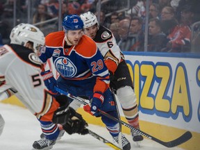 Leon Draisaitl chases down the puck against a couple of Ducks players during a preseason game at Rogers Place in October. (Shaughn Butts)