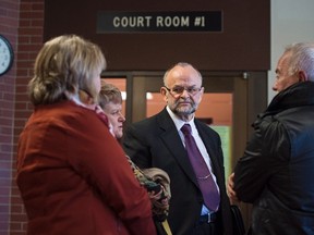 Toronto pastor Brent Hawkes, second from right, speaks with supporters during a break in his trial related to decades-old sex crime allegations at provincial court in Kentville, N.S. on Monday, November 14, 2016. (THE CANADIAN PRESS/Darren Calabrese)