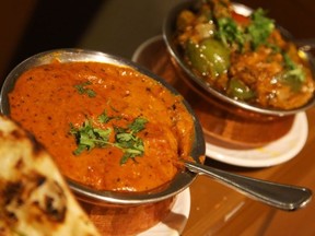 Butter chicken and chicken Jalfrezi at Indian Punjabi Clay Oven. JEAN LEVAC / POSTMEDIA NEWS