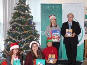 Huntington University and HUGS council members Amelia Baetz, left, Brittany MacGowan, Theresa Rost, Laura Palmer and Huntington University President and Vice-Chancellor Kevin McCormick were on hand to launch the 2016 Christmas Giving Tree Campaign recently. Supplied photo