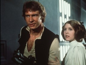 Carrie Fisher as Princess Leia and Harrison Ford as Han Solo in Star Wars. (Handout photo)
