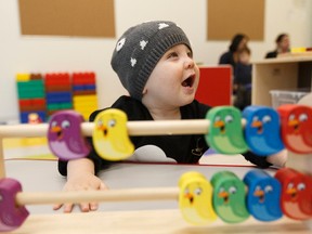 Max Braun, 11-months-old, plays with bird blocks during an open house held at Kids & Company in the Edmonton Tower in downtown Edmonton, Alberta on Tuesday, November 15, 2016. Ian Kucerak / Postmedia
