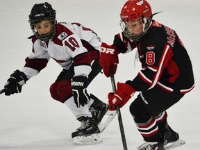 QRD atom minor skater Rylan McCormack carries the puck in recent AAA hockey action. (Photo submitted)