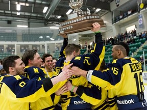 Perhaps the most memorable moment of Klarc Wilsonís final season of organized hockey was this one. He joins teammates in celebrating a perfect season ñ undefeated in both league play and ACAC playoffs with the NAIT Ooks. Wilson is among a growing group of athletes wise enough to recognize the perils of seeking a career in professional sports and the value of education in preparing for a future that carries most of the youngsters in a totally different direction. (Courtesy NAIT Athletics)