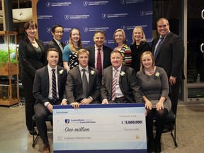 Members of the Perdue family, front, and Laurentian University officials including Dominic Giroux, far right, back row, were on hand for the family's donation Monday. SUPPLIED PHOTO