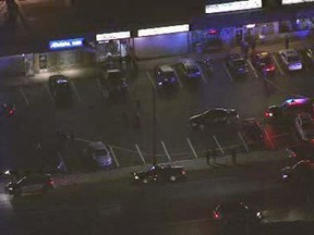 This aerial image taken from video provided by WPVI-TV/6abc shows Porfirio's Pizza and Pasta, located in a shopping plaza in Levittown, Pa., about 25 miles northeast of Philadelphia, Tuesday, Nov. 15, 2016. A pizza shop customer armed with a gun shot and killed one robber and injured another late Tuesday night as they tried to hold up the Pennsylvania restaurant, according to police. One suspect was pronounced dead at the scene. The second suspect was taken to a hospital. His condition was not immediately available. (WPVI-TV/6abc via AP)