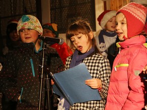 R.H. Murray Public School Snowflake Choir perform at the annual Christmas tree-lighting celebration at Anderson Farm Museum in Lively, Ont. on Saturday December 12, 2015. John Lappa/Sudbury Star/Postmedia Network