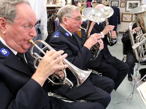 Tim Miller/The Intelligencer
Members of the Salvation Army brass band play Christmas music during the kickoff of the annual Salvation Army Christmas Kettle Campaign on Wednesday in Belleville. The campaign funds a variety of services geared to help those in need.