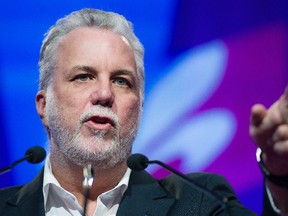 Quebec Premier Philippe Couillard speaks during a Parti Liberal du Quebec (PLQ) general counsel meeting in Laval, Que., Sunday, November 13, 2016. (THE CANADIAN PRESS/Graham Hughes)