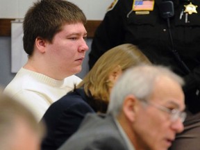 In this Jan. 19, 2010 file photo, Brendan Dassey, left, listens to testimony at the Manitowoc County Courthouse in Manitowoc, Wis. (Sue Pischke/Herald Times Reporter via AP, File)