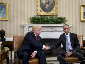 U.S. President Barack Obama shakes hands as he meets with Republican President-elect Donald Trump (L) on transition planning in the Oval Office at the White House on November 10, 2016 in Washington, DC. (JIM WATSON/AFP/Getty Images)