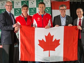 Left to right, OSEG CEO Bernie Ashe, Canadian Davis Cup captain Martin Laurendeau, doubles star Daniel Nestor, Ottawa Mayor Jim Watson and Tennis Canada exec Gavin Ziv hold our country’s flag yesterday during a news conference at TD Place. (Wayne Cuddington, Postmedia Network)