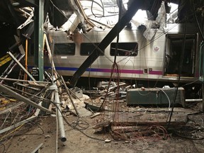This Oct. 1, 2016, file photo provided by the National Transportation Safety Board shows damage from a Sept. 29, 2016, commuter train crash that killed a woman and injured more than 100 people at the Hoboken Terminal in Hoboken, N.J.(Chris O'Neil/National Transportation Safety Board via AP, File)