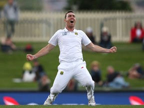 South Africa's Kyle Abbott celebrates the last Australian wicket in their cricket test match in Hobart, Australia, on Nov. 15, 2016. South Africa wins the match by an innings and 80 runs. (RICK RYCROFT/AP)