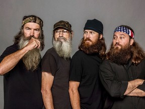 This undated image released by A&E, shows The Robertsons, from left, Phil, Si, Jase and Willie, from the reality series, "Duck Dynasty." (Zach Dilgard/A&E via AP)