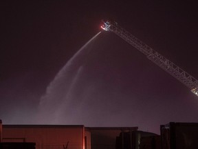 Halifax regional firefighters battle a fire at Capital Seafood in Halifax early Thursday morning, November 17, 2016. A major fire has caused extensive damage at a fish processing plant on Nova Scotia's eastern shore. (THE CANADIAN PRESS/Darren Calabrese)