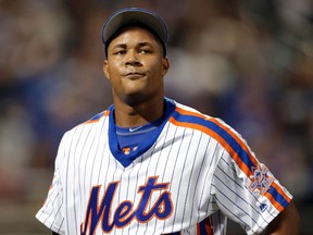 In this May 29, 2016, file photo, New York Mets relief pitcher Jeurys Familia reacts as walks off the field during the ninth inning of the baseball game against the Los Angeles Dodgers at Citi Field in New York. (AP Photo/Seth Wenig, File)