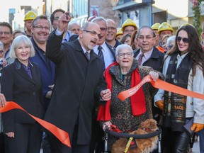 Tim Miller/The Intelligencer
Mayor Taso Christopher cuts the ribbon signifying the official end of Phase 2 of downtown construction on Thursday in Belleville.