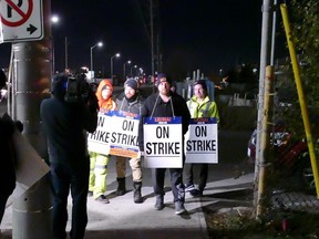 A small protest ensued after garbage workers in Peel Region went on strike and workers brandished signs at a gas station on Britannia Rd. south of the intersection of Atlantic Ave. in Mississauga.(Pascal Marchand photo)