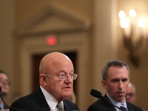 Director of National Intelligence James Clapper (L) speaks as Defense Undersecretary for Intelligence Marcel Lettre (R) listens during a hearing before the House (Select) Intelligence Committee November 17, 2016 on Capitol Hill in Washington, DC. Clapper said he has submitted letter of resignation last night. (Alex Wong/Getty Images)