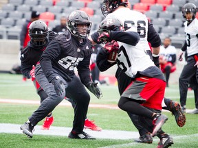 Redblacks' Moton Hopkins (left). (Ashley Fraser, Postmedia Network)