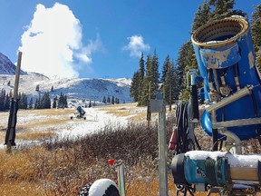 In this Nov. 2, 2016, file photo, a snow gun sits on an expanse of brown grass near the top of the Black Mountain Express run at Arapahoe Basin Ski Area near Keystone, Colo. Autumn snow has been scarce in the Rocky Mountains, forcing some ski areas to push back opening day and raising concerns about how much water will be available next spring for the Colorado River. But the first big storm of the season is expected to blow into Colorado and Utah on Thursday, Nov. 17, 2016. (Phil Lindeman/Summit Daily News via AP, File)