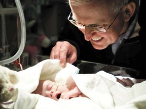 University of Alberta medical researcher David Olson checks on a newborn in hospital in this undated file photo. Supplied by the University of Alberta.