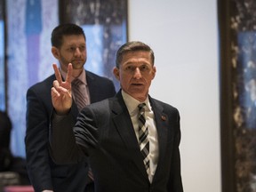 Retired Lt. Gen. Michael Flynn gestures as he arrives at Trump Tower, November 17, 2016 in New York City. President-elect Donald Trump and his transition team are in the process of filling cabinet and high level positions for the new administration. (Photo by Drew Angerer/Getty Images)
