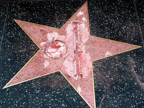 This Oct. 26, 2016 file photo shows the vandalized Hollywood Walk of Fame star of then-presidential candidate Donald Trump. Authorities say James Lambert Otis, the man who allegedly used a sledgehammer to deface the star of the man who is now president-elect, has been charged with felony vandalism. The Los Angeles County District attorney said the charge was filed Thursday, Nov. 17, 2016. (AP Photo/Richard Vogel, File)