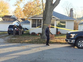 Montgomery County Sheriff's deputies remove items from a minivan during a double homicide investigation in the 200 block of Madison Street Thursday, Nov. 17, 2016, in Darlington, Ind. Montgomery County Sheriff Mark Casteel 30-year-old Brandi Worley killed her two young children then stabbed herself in the neck a day after her husband filed for divorce. (Joseph Paul/Journal & Courier via AP)