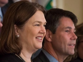 Canada's opioid epidemic will be front and centre today in Ottawa, where politicians will meet with members of the medical community with the common goal of curbing drug addiction and saving lives. Federal Minister of Health Jane Philpott, left, and Ontario Health Minister Eric Hoskins sit for an official photo before the final day of a meeting of provincial and territorial health ministers in Vancouver, B.C., on Thursday January 21, 2016. (THE CANADIAN PRESS/Darryl Dyck)