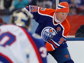 In this Oct. 22, 2016, file photo, former Edmonton Oiler Wayne Gretzky (99) skates against the Winnipeg Jets alumni in Winnipeg. (John Woods/The Canadian Press via AP, File)