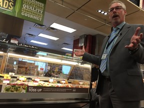 Mike Olson, vice-president of Save-On-Foods, shows off the chain's new McPhillips Street location on Friday. (DAVID LARKINS/WINNIPEG SUN/POSTMEDIA NETWORK)