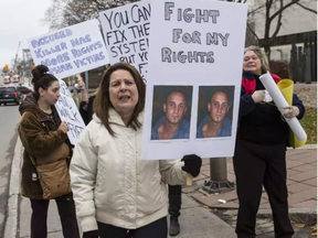 Family and supporters of homicide victim Fouad Nayel, including his mother Nicole (white jacket), protested outside of the Ottawa Courthouse on Thursday November 17, 2016. (Errol McGihon, Postmedia)