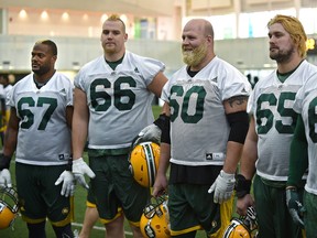Some of the Eskimos offensive linemen with their hair dyed yellow as they practiced indoors at the Field House in Edmonton, Friday, November 18, 2016. From left, D'Anthony Batiste, Matthew O'Donnell, Justin Sorensen, Simeon Rottier and Joel Figueroa.