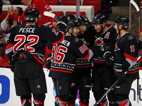 Hurricanes' Jordan Staal (11) celebrates his goal with teammates Elias Lindholm (16), Jaccob Slavin (74), Teuvo Teravainen (86) and Brett Pesce (22) against the Capitals during NHL action in Raleigh, N.C., on Nov. 12, 2016. (Karl B DeBlaker/AP Photo)