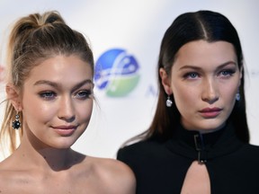 Gigi Hadid (L) and Bella Hadid attend the Global Lyme Alliance 'Uniting for a Lyme-Free World' Inaugural Gala at Cipriani 42nd Street on October 8, 2015 in New York City. (Photo by Dimitrios Kambouris/Getty Images for Global Lyme Alliance)
