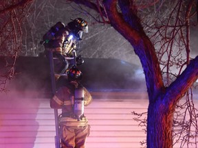 Fire crews respond to a house fire at 116 Avenue and 127 Street in central Edmonton on Friday, November 18, 2016. Shaughn Butts/Postmedia