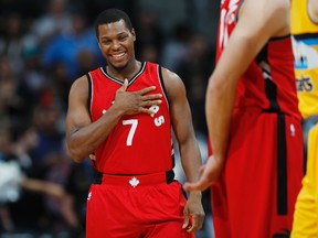 Raptors guard Kyle Lowry smiles as he takes the court after greeting members of the Nuggets during NBA action in Denver on Friday, Nov. 18, 2016. (David Zalubowski/AP Photo)