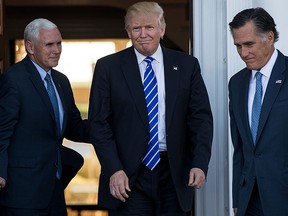 (L to R) U.S. Vice president-elect Mike Pence, President-elect Donald Trump and Mitt Romney leave the clubhouse after their meeting at Trump International Golf Club, Nov. 19, 2016 in Bedminster Township, N.J. (Drew Angerer/Getty Images)