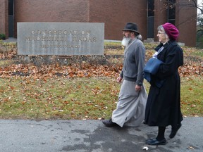 Members of the public arrive at a multifaith solidarity event at Congregation Machzikei Hadas synagogue in Ottawa on Saturday
