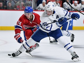 Maple Leafs’ Tyler Bozak controls the puck as Canadiens’ Alexei Emelin gives chase on Saturday night at the Bell Centre in Montreal.  Bozak says rookie teammate Mitch Marner’s enthusiasm has been contagious. “It’s nice to have that excitement,” Bozak says.