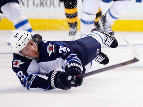 The Jets could ask Toby Enstrom to waive his no-trade clause. (AP File Photo/Winslow Townson)