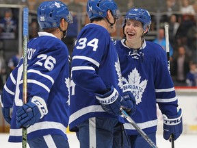 Mitchell Marner, Auston Matthews, and Nikita Soshnikov of the Toronto Maple Leafs celebrate a victory against the Vancouver Canucks in an NHL game at the Air Canada Centre on November 5, 2016 in Toronto, Ontario, Canada.(Claus Andersen/Getty Images)