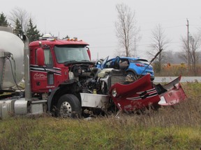 Lambton OPP closed a section of Plank Road, at the intersection with Highway 40, on Saturday November 19, 2016 in Sarnia, Ont., after a transport truck came into collision with a passenger vehicle. Both drivers were taken to hospital and the intersection remained closed for several hours. Paul Morden/Sarnia Observer/Postmedia Network