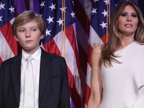 Barron Trump and his mother Melania Trump stand on stage after U.S. President-elect Donald Trump delivered his acceptance speech at the New York Hilton Midtown in the early morning hours of Nov. 9, 2016 in New York City. (Photo by Chip Somodevilla/Getty Images)