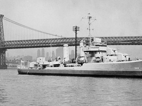 In this undated file photo provided by the U.S. Navy, the USS Turner is pictured on the East River in New York City near the Williamsburg Bridge.  (AP Photo/U.S. Navy, File)