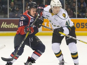 London Knights forward Max Jones battles with Luke Boka of the Windsor Spitfires during a game on Nov. 20, 2016. (Free Press file photo)