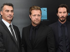 Director David Leitch (centre), seen here with director Chad Stahelski and actor Keanu Reeves, has signed on to direct Deadpool 2. (Jamie McCarthy/Getty Images)