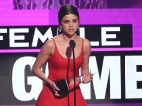 Selena Gomez accept the award favorite female artist pop/rock at the American Music Awards at the Microsoft Theater on Sunday, Nov. 20, 2016, in Los Angeles. (Photo by Matt Sayles/Invision/AP)